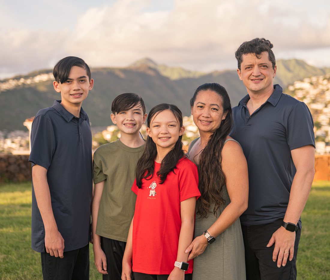 David Croswell standing with his family in East Honolulu
